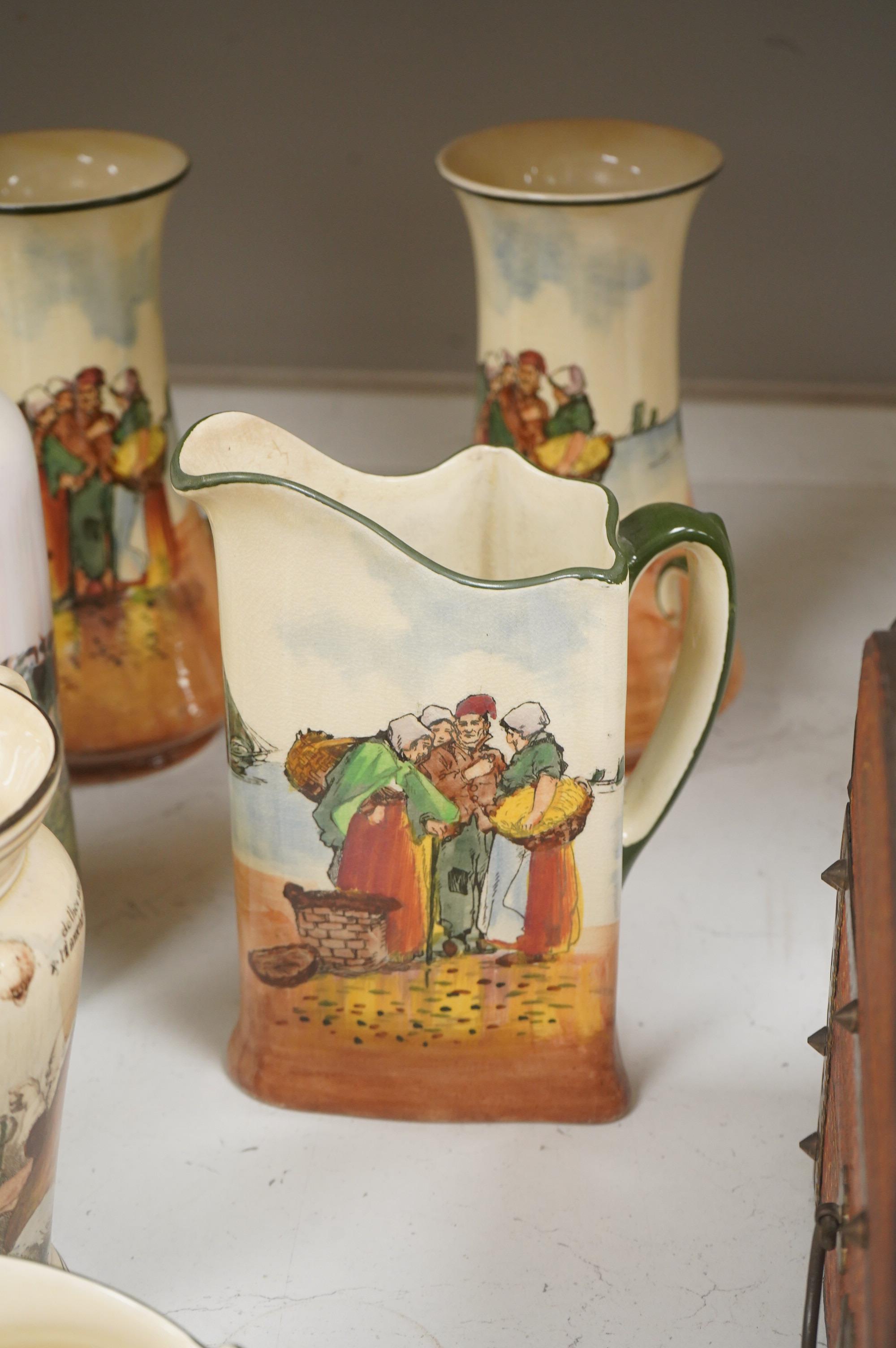 A collection of Royal Doulton series ware jugs, vases and candlesticks, largest 22cm high